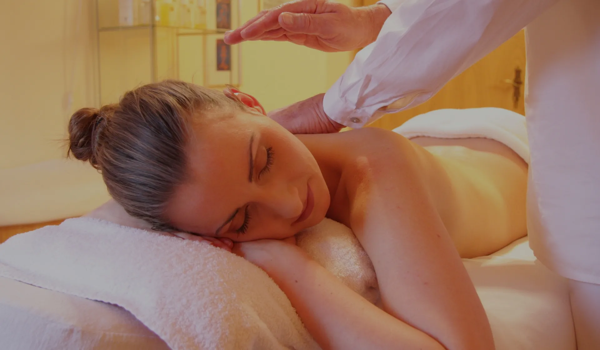 VIP Massage Studio - young woman being massaged